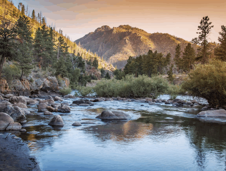 Rafters conquering Class IV rapids on Cache la Poudre Wild & Scenic River near Fort Collins, Colorado with Rapid Transit Rafting